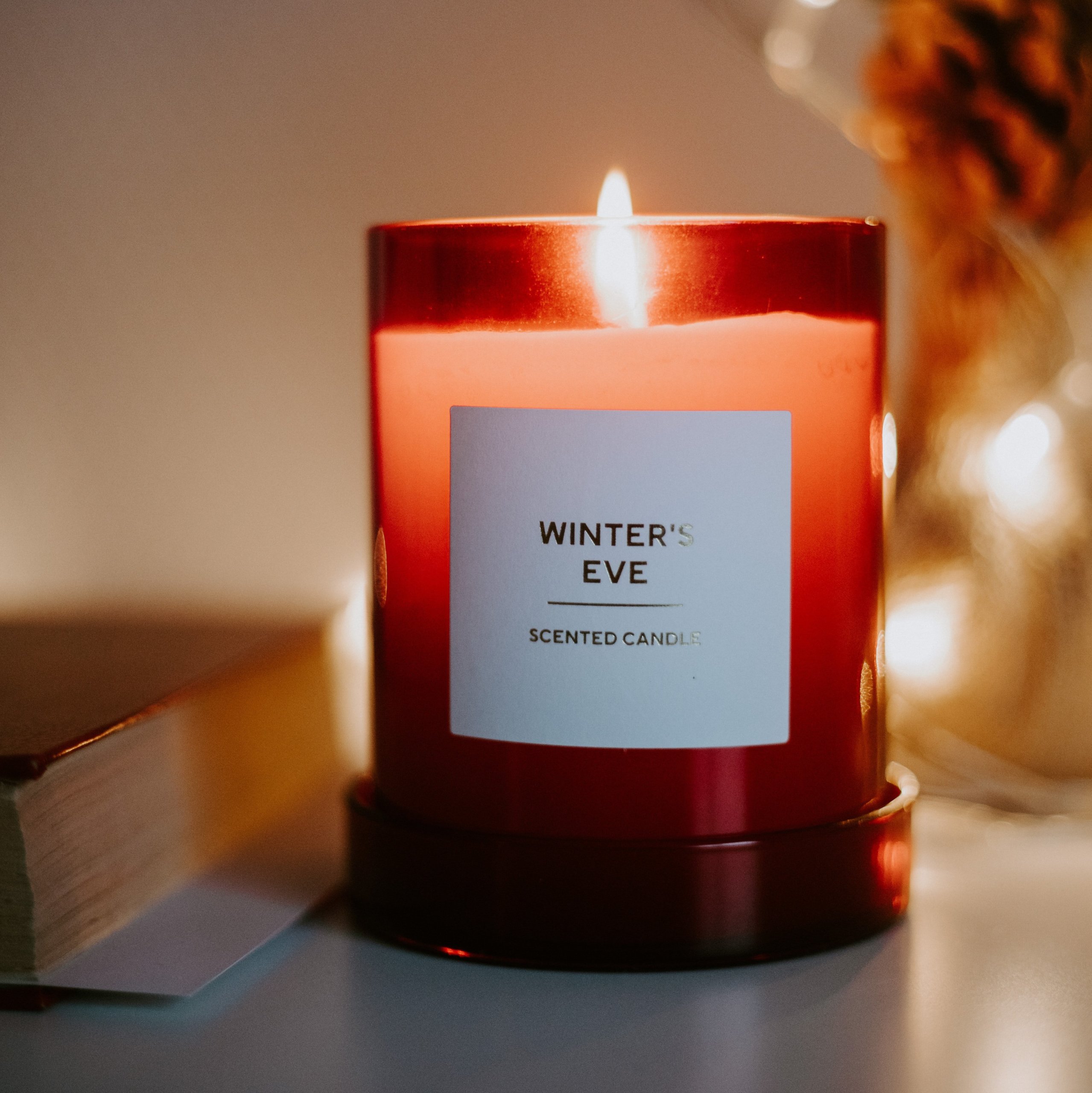 lit candle in glass jar